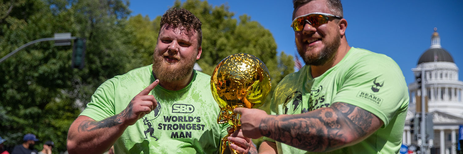 People from SBD Apparel holding a trophy